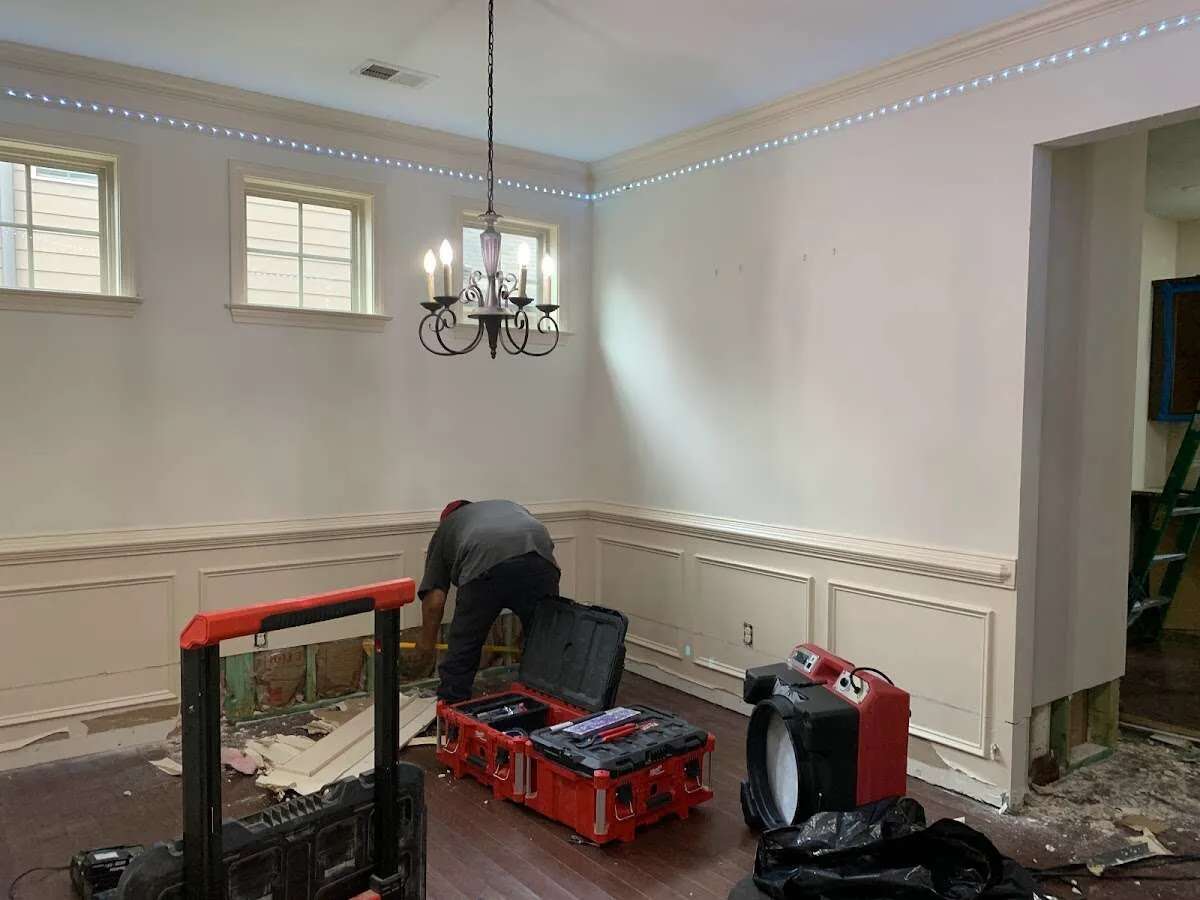 Restoration technician with professional equipment in Mineola